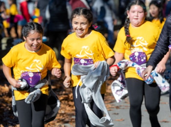 Three girls running together